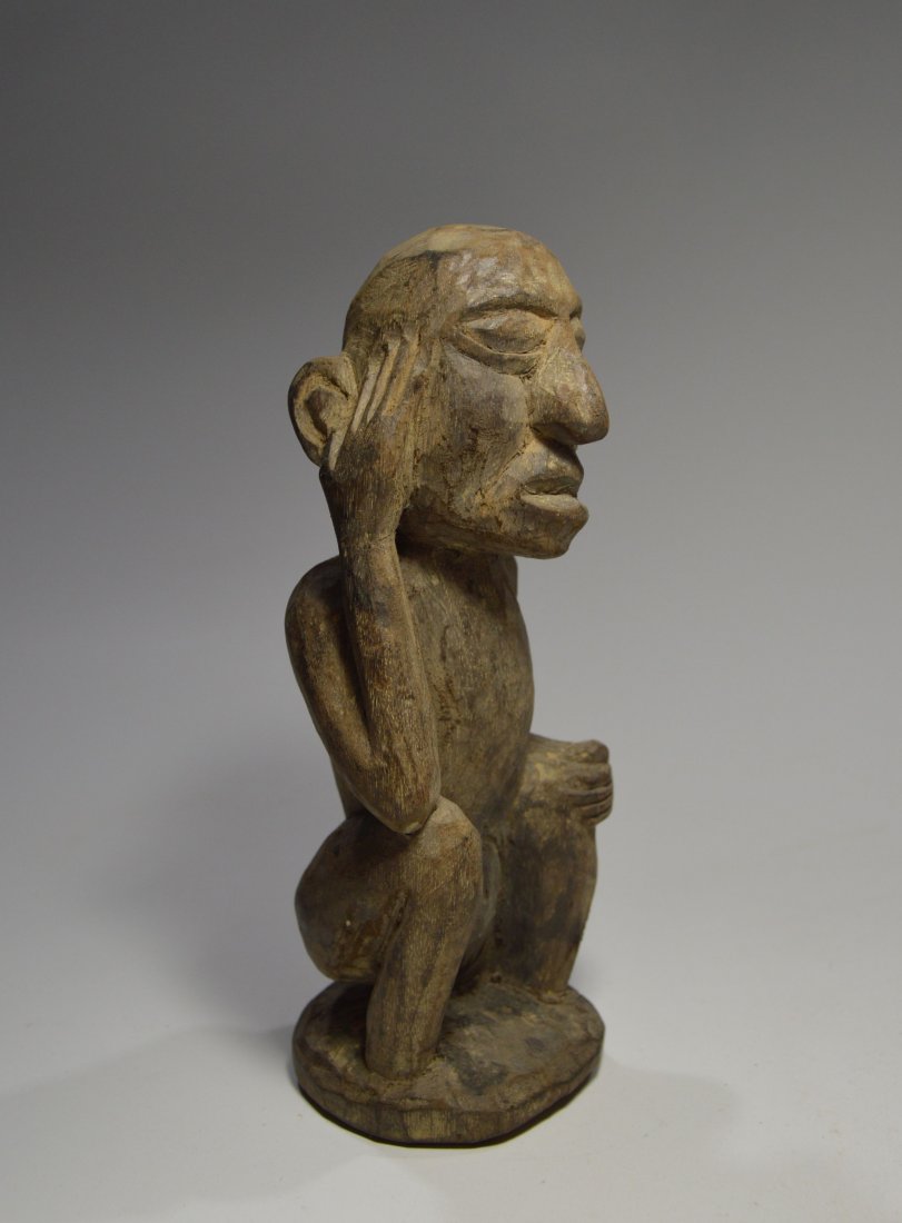 Antique Naga Thinker Sculpture Ex Museum Collected 1970: This is an antique carved wooden male effigies shown in a ":thinker" pose. The Naga , a fierce head hunting tribe were known for their use of trophy heads as part of their shrines and ritual dances. T