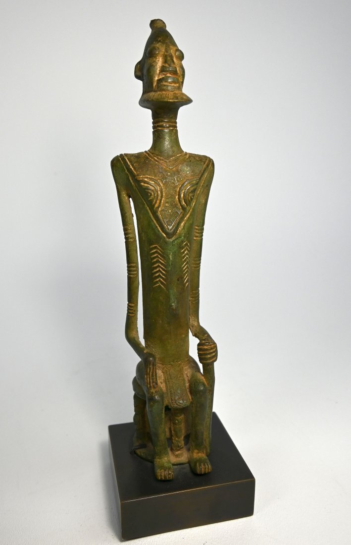 Contemporary Bronze Sculpture of a Chief: A finely cast contemporary bronze sculpture of a seated Chief with elongated features. Dogon peoples, Mali, Africa. The bronze measures 13 inches tall on base.