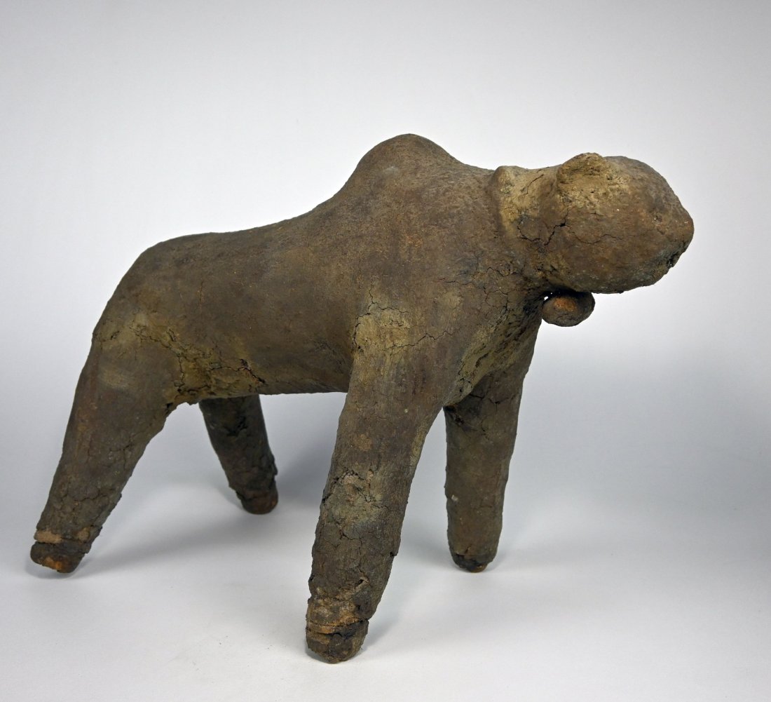 A Bamana Boli Magic Fetish: A Zoomorphic form encrusted with dried blood, cow dung, chewed up and spat kola nuts and other organic material. The primary function of a boli is to accumulate and control the naturally occurring lif
