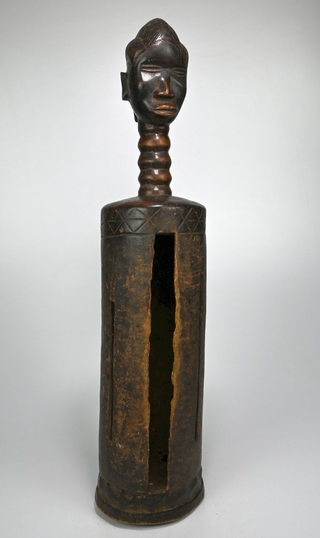 A Rare Old Dan Slit Gong with Ancestor Face (1 of 8)