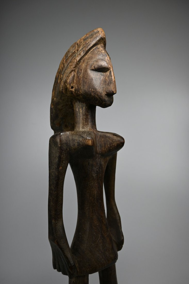 A Rare Bozo Female Sculpture Ex Banks Collection: A Carved wooden female effigy with highly stylized form and features, well handled, smooth surface patina suggests field use over many years, perhaps generations. Bozo or Bamana peoples, Mali, Africa.