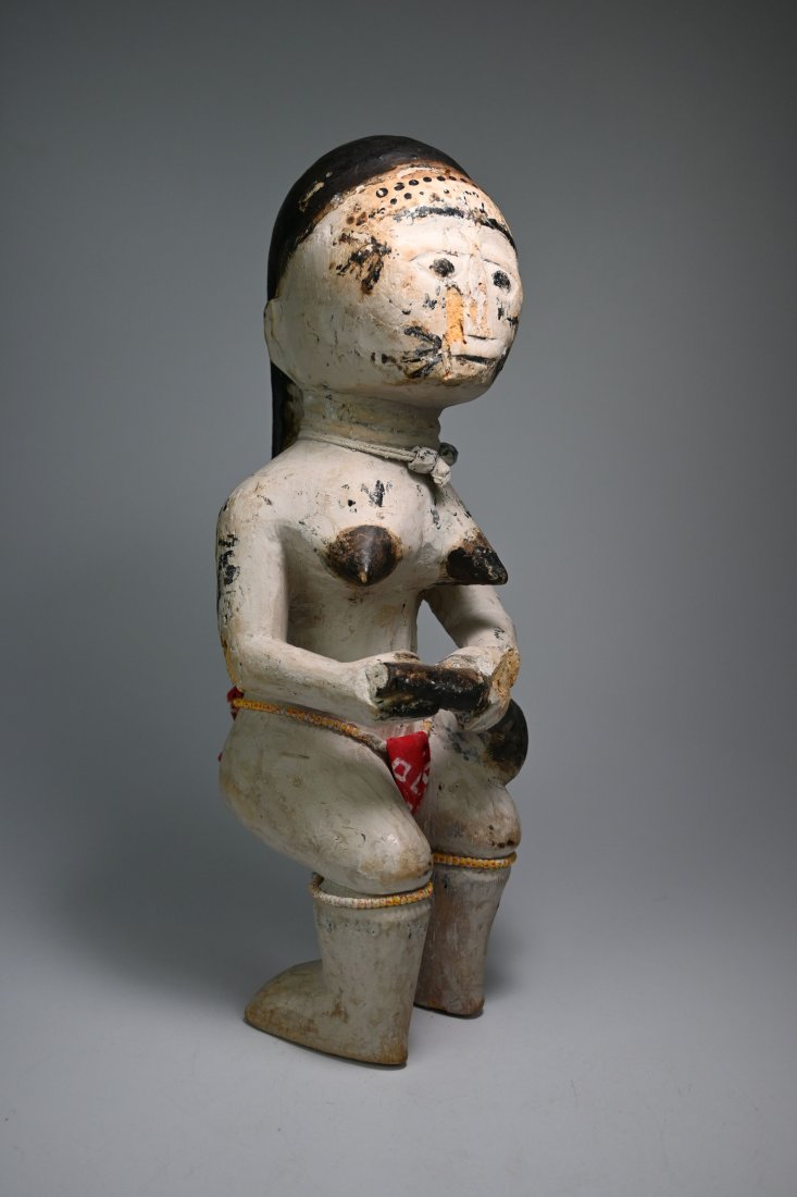 Fanti Asamanukpai Dwarf Bush Spirit with Magic Calabash: A Very rare and esoteric image of the mysterious Asamanukpai.Such idols are very uncommon and are a visual reference to a story told throughout various regions of west Africa. The Asamanukpai are myst
