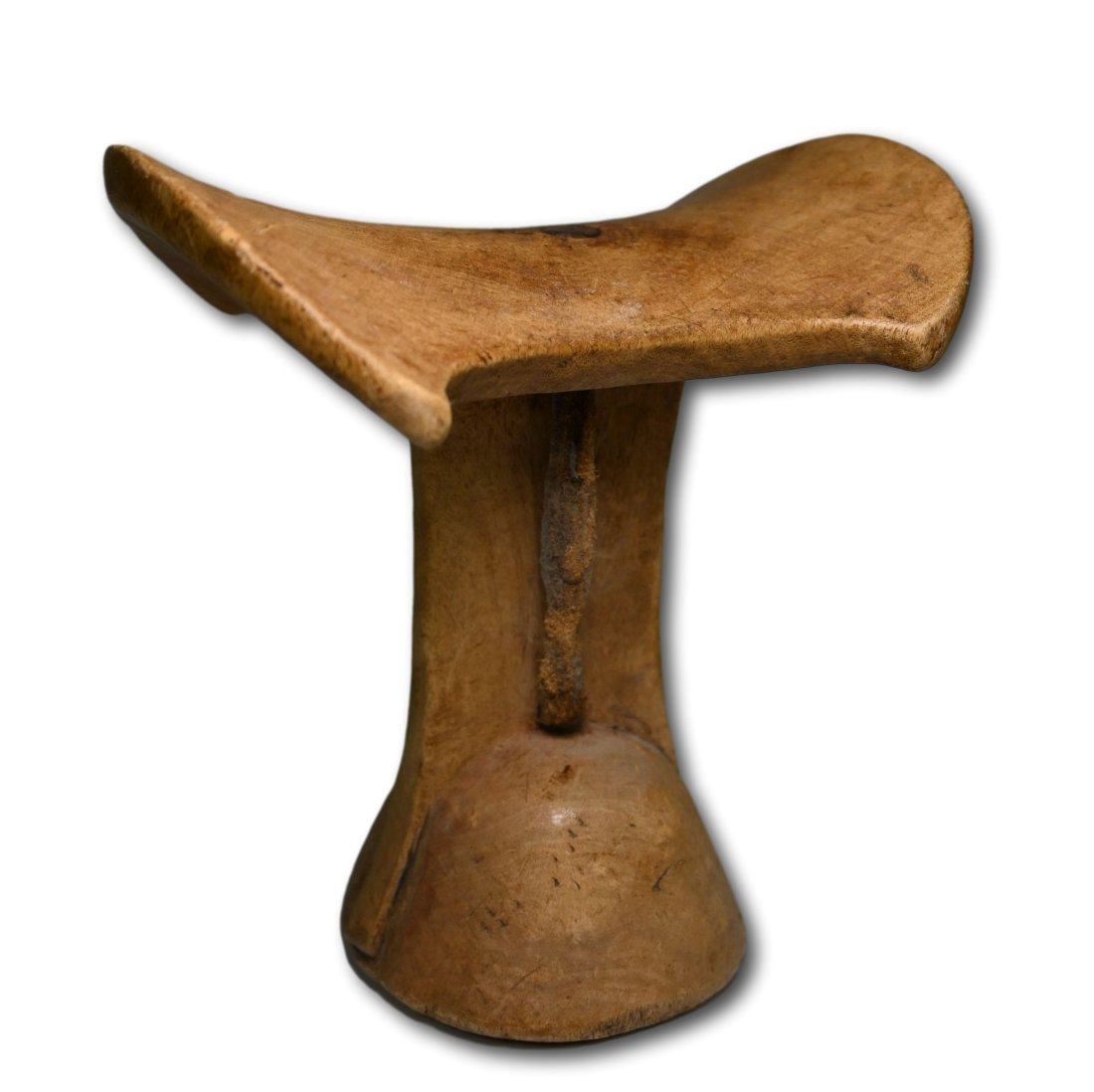 Antique Turkana Headrest: A carved wooden headrest with wonderful classic form and well handled surface. Turkana peoples, Tanzania, Africa. The headrest measures 6.5 x 6 inches. Provenance: The Evan Maurer collection, CA, USA.