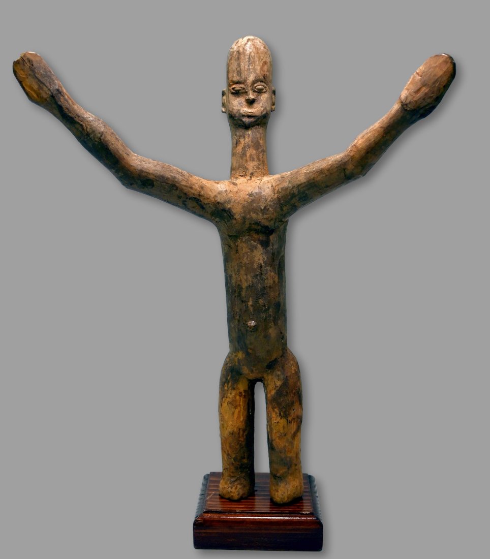 A Lobi Ti Puo Shrine Idol: A carved wooden shrine idol with hands extended to the heavens, considered a protective fetish and typically placed on shrines to act as a medium to the spirit world. Lobi peoples, Burkina Faso, West 