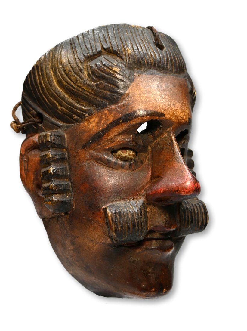 Antique Dance Mask from Guatemala: A finely carved wooden dance mask with incised designs, painted facial features and nut shell's inset into the eyes. Guatemala, central America. The mask measures 8 x 6 inches.