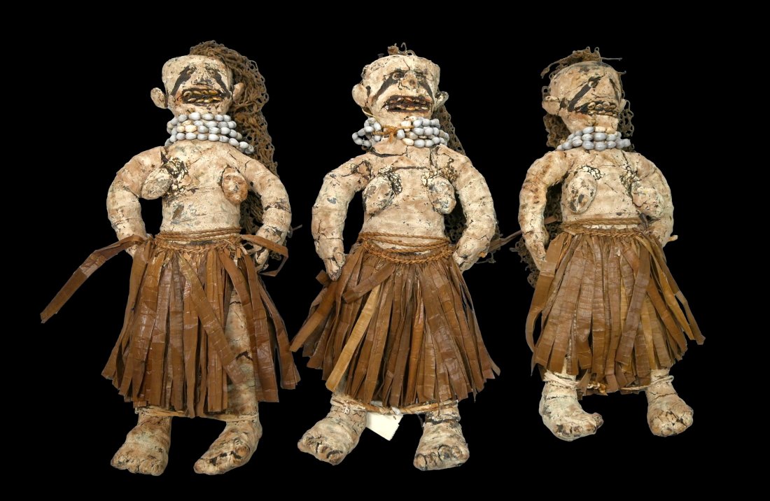 Lot of Three Payback Dolls: Three late Mendi payback doll. Mendi people, Southern Highlands Province, Papua New Guinea.Of typical form, the three female dolls made of mud and white clay over a wooden frame, the faces with expres