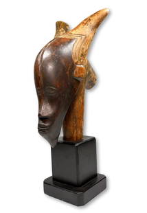 A Rare Guro Parade Bust or Marionette Ex Scanzi: A very large and dramatic carved wooden parade bust or marionette head with classic Guro mask like face, extended horns and well handled surface. This is a large carving suggesting it was carried in a