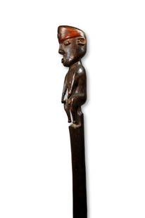 A Fine Pende Staff Ex Sotheby's: A very finely carved wooden staff featuring a well carved anthropomorphic figure on top with a deep well handled surface patina. The Staff measures 37.5 inches tall. 39 inches tall on professional cus