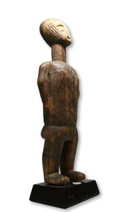 Rare Abron Figure Ex Dr Endicott Collection: A carved wooden female effigy with head tilted slightly back looking to the stars, and featuring traditional scar designs on the face and a well weathered and worn surface patina. Abron peoples, Ghana