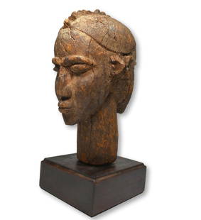 Archaic Lobi Janus Shrine Head: A carved wooden janus form head with elongated cylindrical neck, ridged coiffure and a well weathered surfca e suggesting many years as a shrine object. Lobi peoples, Burkina faso, West Africa. The he