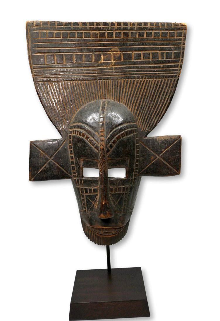 A Bamana African Mask: A tall carved wooden mask with incised linear designs and a wonderful tall headdress, well handled surface and overall fantastic style. Bamana peoples, Mali, West Africa. The mask measures 24 inches t