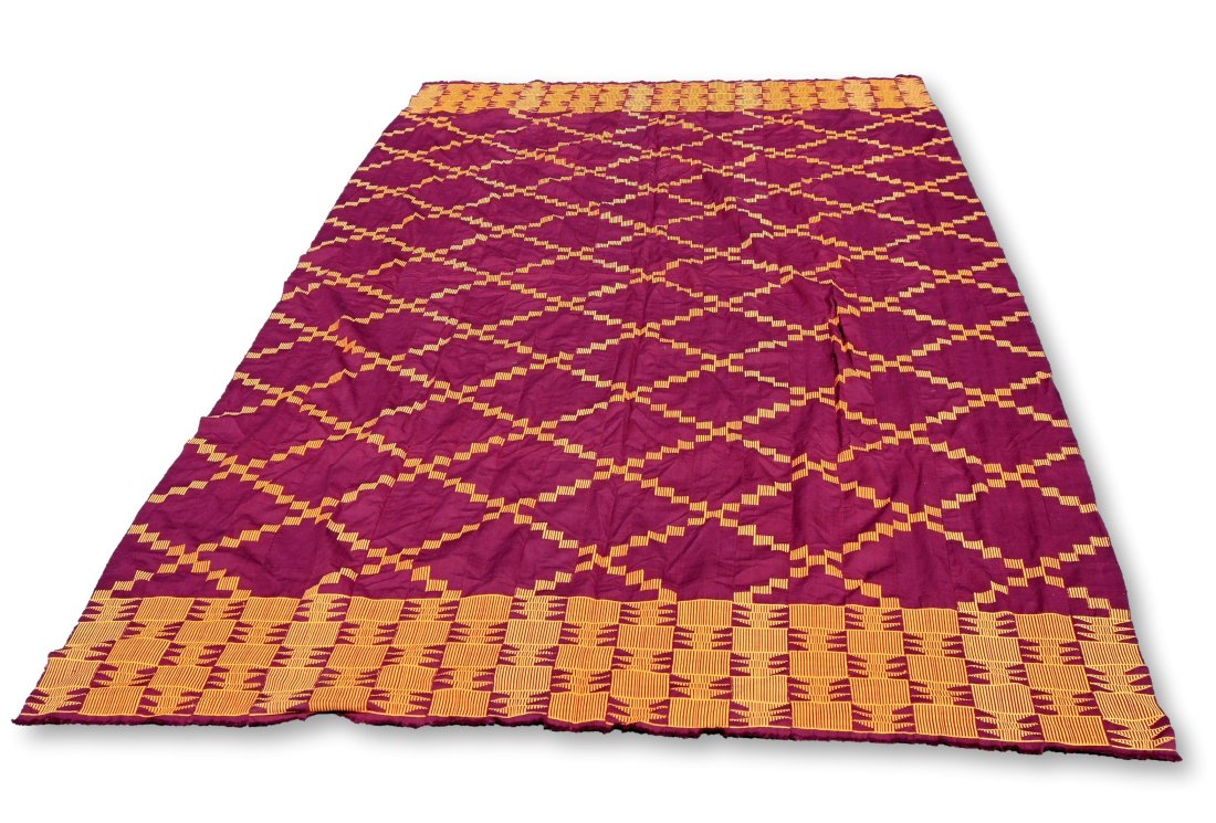 A Large Ashanti Kente Cloth from Ghana: A very large traditional Kente wrap cloth woven on small hand looms in strips and then sewn together. This is a classic example with a rich burgundy and gold color and excellent design. Ashanti people