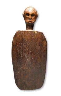 Exceedingly Rare Flores Island Chopping Block Ex Cootner: A very rare old carved wooden working block with ancestral head on top as a handle. Such a carving may have been used in the preparation of medicines by a village shaman. The Block and head handle