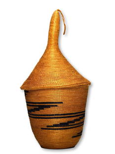 Antique Lidded Basket from The Tutsi Peoples, Rwanda: A beautiful antique hand woven Agaseki or Ibeseke basket from the Tutsi people of Rwanda, Central Africa. This basket measures 9 inches tall x 4.75 inches wide with it's conical lid.