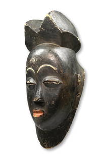 A Rare Black Punu Mask Ex Marcellis Collection, France: A very rare and desirable Black Punu carved wooden mask. Punu peoples, Gabon, Africa. Provenance: Ex Jean and Marie Marcellis, France; Purchased prior to 1969. Blackened Punu masks are extremely