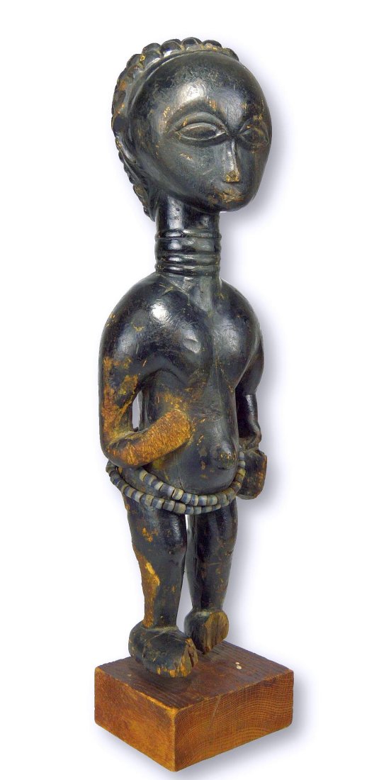 Lovely Lady of the Lagoons Anyi Female Effigy: A very old and interesting carved wooden female effigy with well worn and well handled features, and shown holding a woman's satchel. The sculpture has a ringed neck , a symbol of status among the loc