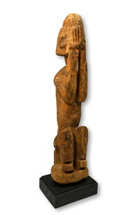 Eroded Old Dogon Shrine Sculpture of Dyougou Serou: A carved wooden male effigy of Dyougou Serou, and is shown hiding his face in his hands in shame for his misdeed.This sculpture measures 15 inches tall or 16.5 inches tall on professional custom displ