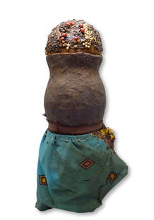 A Rare Tonga Doll: A Rare, old and well used gourd doll with reversed gourd head and base, inset abrus and other seeds and old textiles attached as a skirt. This example is likely from the early 20th century. Such dolls