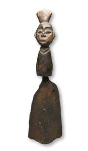 Archaic Bamun Ceremonial Iron Bell Ex Marshall Mount Collection: Old and well used ceremonial iron bell with well worn wooden handle featuring an ancestor face. Bamun peoples, Cameroon, West Africa. The bell measures 16.5 inches tall. Provenance: Ex Marshall Mount