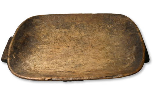 A Zulu Serving Tray or Meat Platter Ex Becker Collection: A very finely carved wooden ceremonial serving tray or meat platter with traditional classic form, well handled and worn surface, an overall well used example. The Tray measures 17.25 x 12 inches. Zul