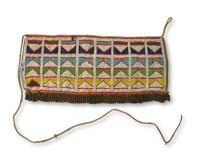 Beautiful Antique Zulu Beaded Skirt: A Long well made beaded skirt panel with fine beadwork designs and embellished with copper chains. The Sash or belt measures 12 x 6 inches. Provenance: Ex Charles Bordogna Collection, Author and past