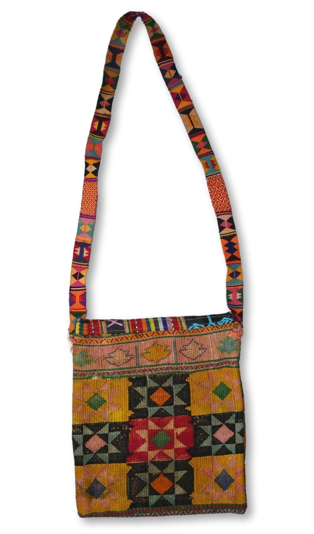 Antique Medicine or Betel Nut Bag from Timor, Indonesia: A fine old Betel nut carrying Bag known locally as a Aluk, from the Lelonama district of Western Timor Indonesia. Kilim woven fabric was used in making this betel bag or purse which features detailed 