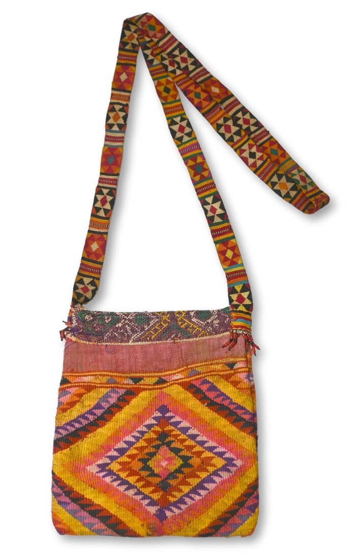 Aluk Medicine Bag from Timor Island, Indonesia: A fine old Betel nut carrying Bag known locally as a Aluk, from the Lelonama district of Western Timor Indonesia. Kilim woven fabric was used in making this betel bag or purse which features detailed 