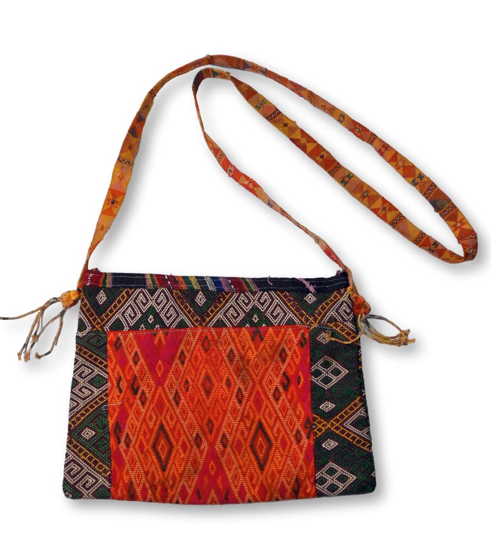 Old Timor Island Medicine Bag: A fine old Betel nut carrying Bag known locally as a Aluk, from the Lelonama district of Western Timor Indonesia. Intricate woven fabric adorned with textile tassels were used in making this betel bag