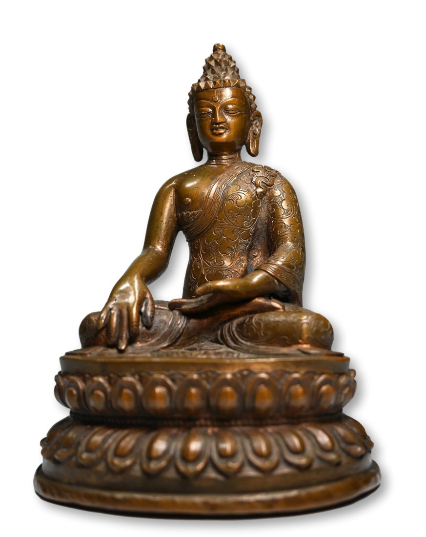 A Fine Shakyamuni Bronze Buddha: A Finely cast twentieth century Sino-Tibetan bronze/copper alloy Shakyamuni. Buddha sits in bhumisparsha mudra or "calling to witness" which was the position he assumed directly after enlightenment. T
