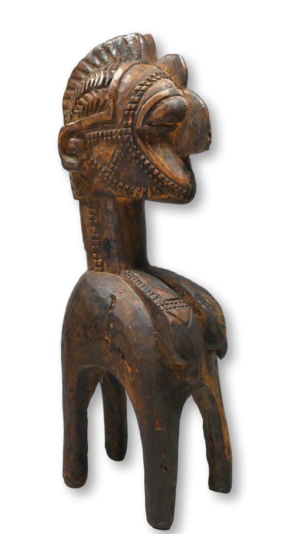 A Baga Nimba Sculpture Ex Bergmann Estate: A carved wooden shoulder mask style form and sculpture as the traditional Nimba or Dmba of the Baga peoples, representing femininity and fertility and typically found at agricultural festivities. This