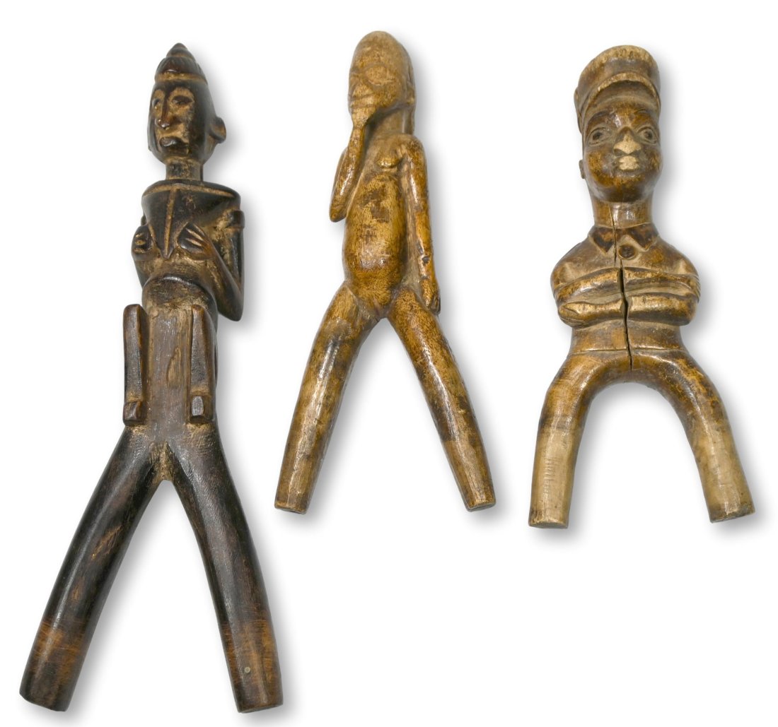 Lot of Three African Slingshots Ex Gould Collection: This lot contains three carved wooden slingshots from west Africa. This lot has a large slingshot from the Dogon that measures 10 inches tall, a well worn Lobi slingshot that measures 7.5 inches and a
