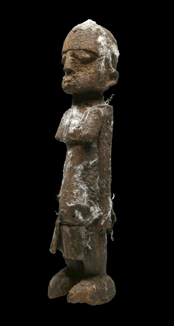 Encrusted Lobi Magic Fetish: A carved wooden shrine idol encrusted with offerings and organic matter. A Bateba Thil Phuwe or spirit idol, Lobi Peoples, Burkina Faso, West Africa. The sculpture measures 16 inches tall. Provenance: