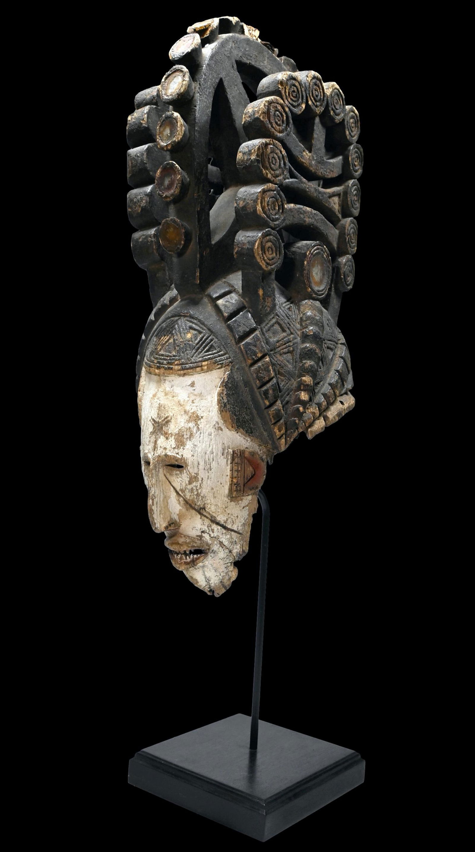 Igbo Maiden Spirit Mask Ex kahan Gallery 1980s: A Very fine Old carved wooden ceremonial mask with tall superstructure on top embellished with pieces of glass and mirrors. These “maiden spirit” masks (agbogho mmwo) are worn at festivals tha