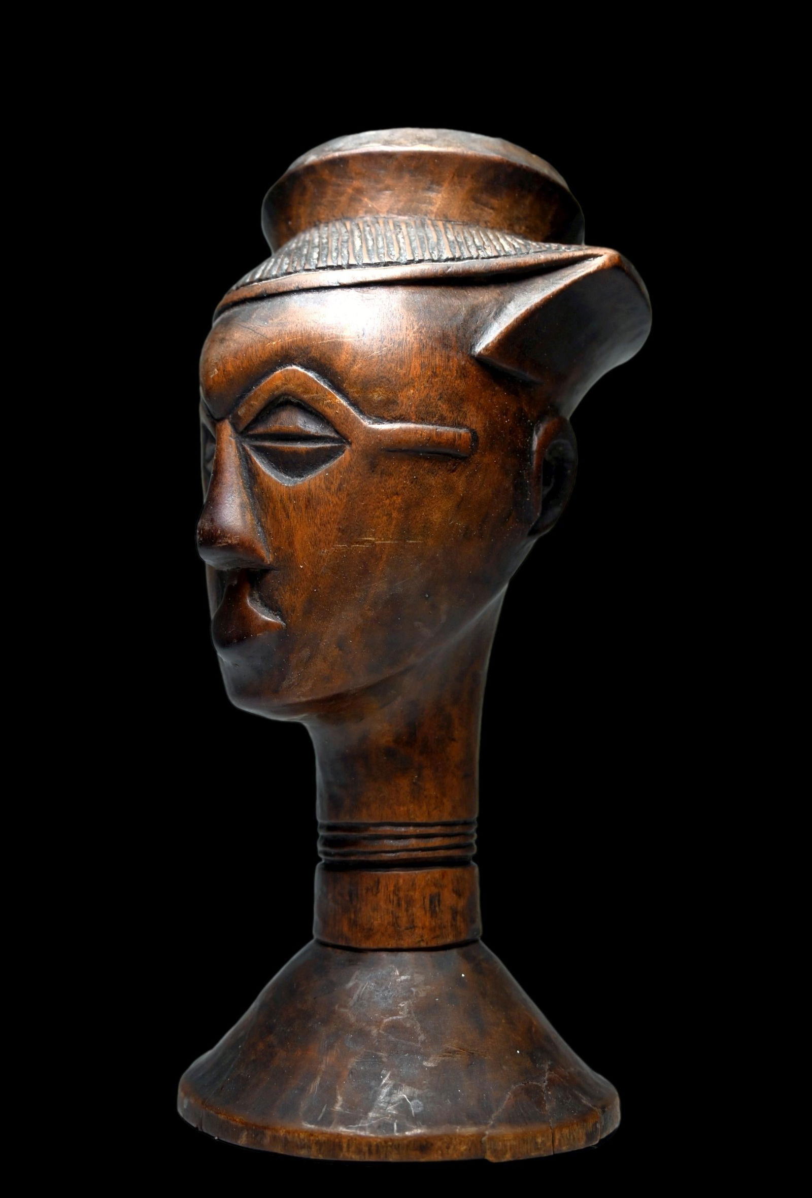 A Fine Kuba Cup Ex Sotheby's Park Bernet 1976: A very fine old carved wooden palm wine beaker with stylized ancestor head as the cup, classic facial features, well handled surface patina suggests good age and field use. Kuba peoples, DRC/ Congo, c