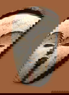 A Vuvi Mask Ex Barthels Collection: A Vuvi ancestor (moghondzi) mask. Gabon, Central Africa. According to research such masks were traditionally used during bwete/bwiti initiation ceremonies for young people in the community. Wood,