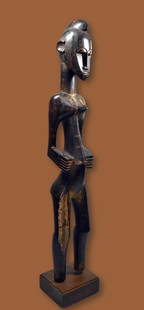 Fine Senufo Deble Female Sculpture: A very finely carved wooden female effigy with a beautiful polished surface. Such sculptures are also known as Deble, or Rhythm Pounders. This sculpture measures 44.5 inches tall on professional