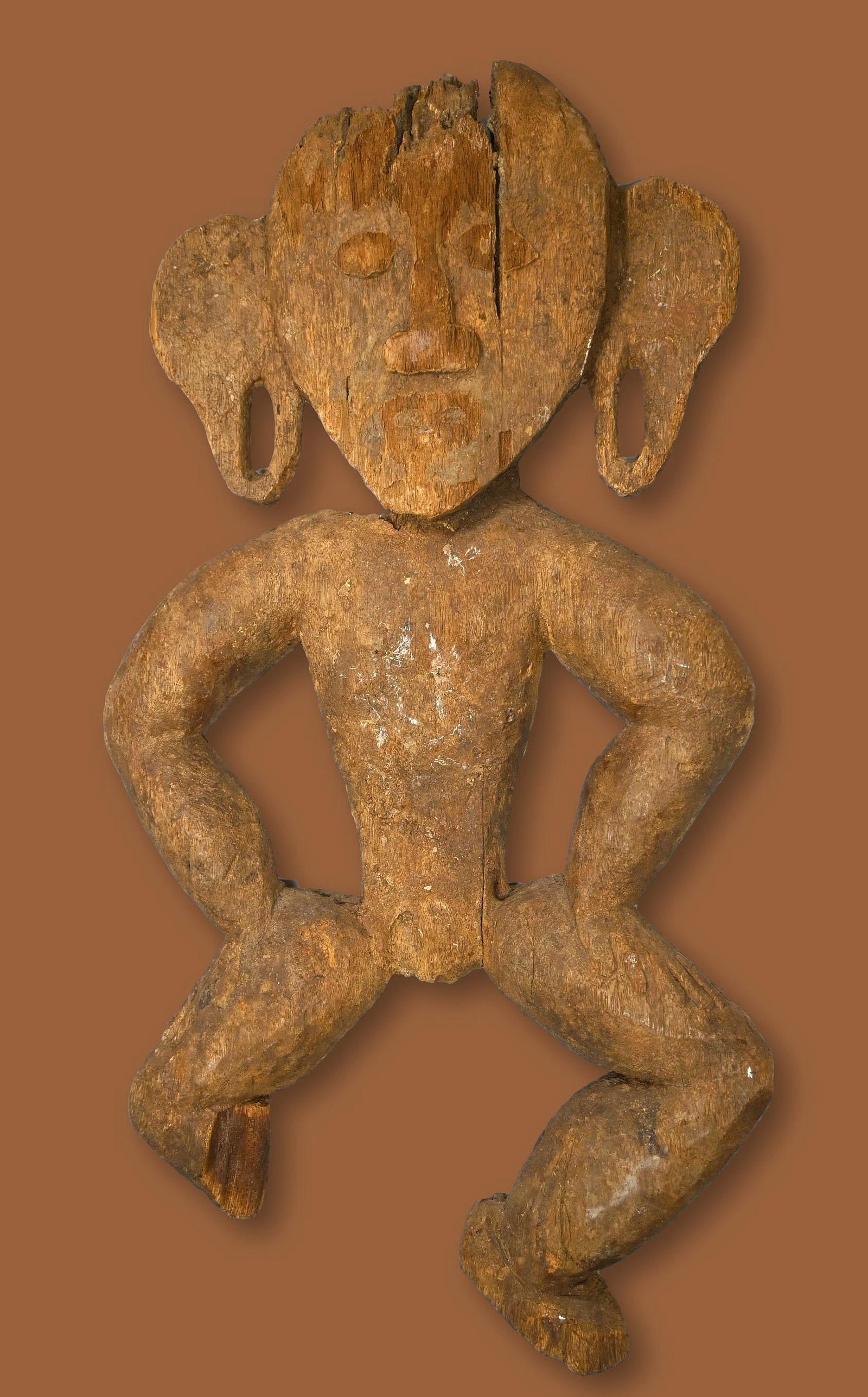 Archaic Dayak Sculpture Ex: Templeton Collection: A weathered and eroded guardian type sculpture with a highly stylized form and obvious erosion. The sculpture measures 25 x 13 inches. Dayak peoples, Borneo / Kalimantan, Indonesia. Ex Templeton Colle