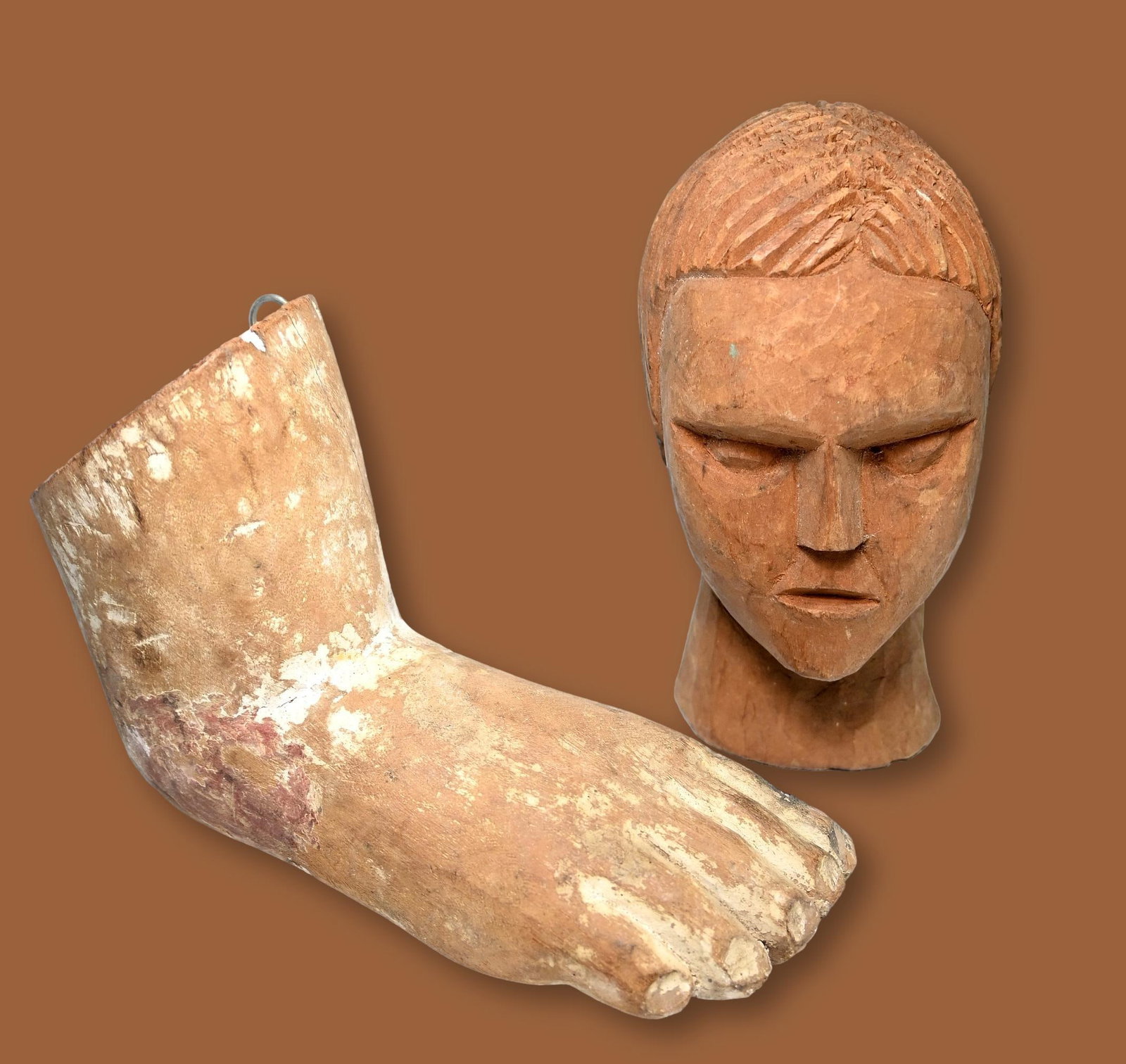 Antique Ex Voto Head and Leg Collected in Brazil: A set of antique Milagros or Ex Voto offerings collected Brazil, South America. In northeastern Brazil, ex-votos, called milagres in Portuguese, can be found at hundreds of important shrines where pil