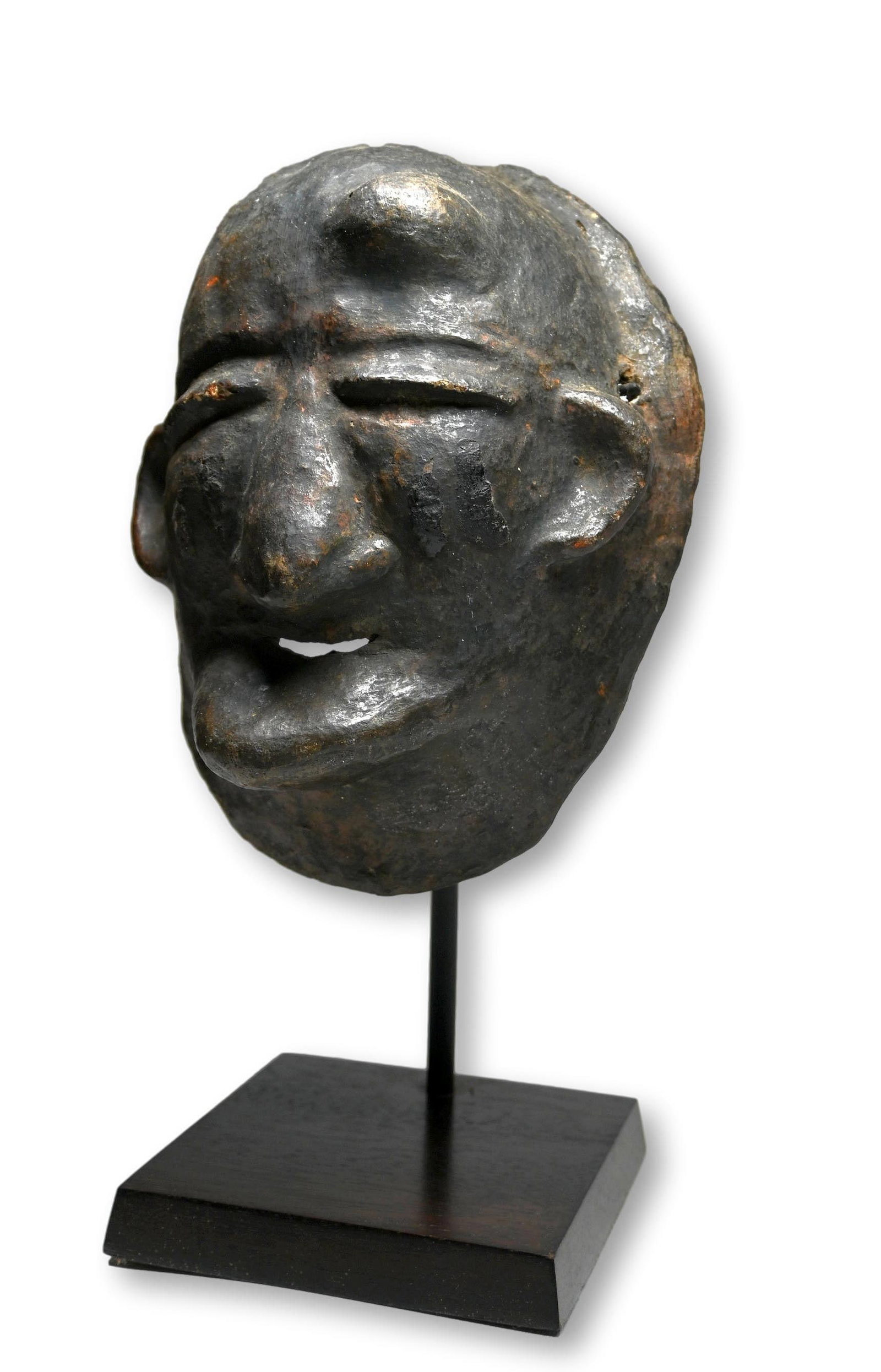 A Rare Makonde Terracotta Mask Ex Banks collection: A very uncommon terracotta clay mask made by the women of the tribe, known as vitengamatu or literally open your ears is traditionally danced only once a year in the final coming-out ceremonies (nkama