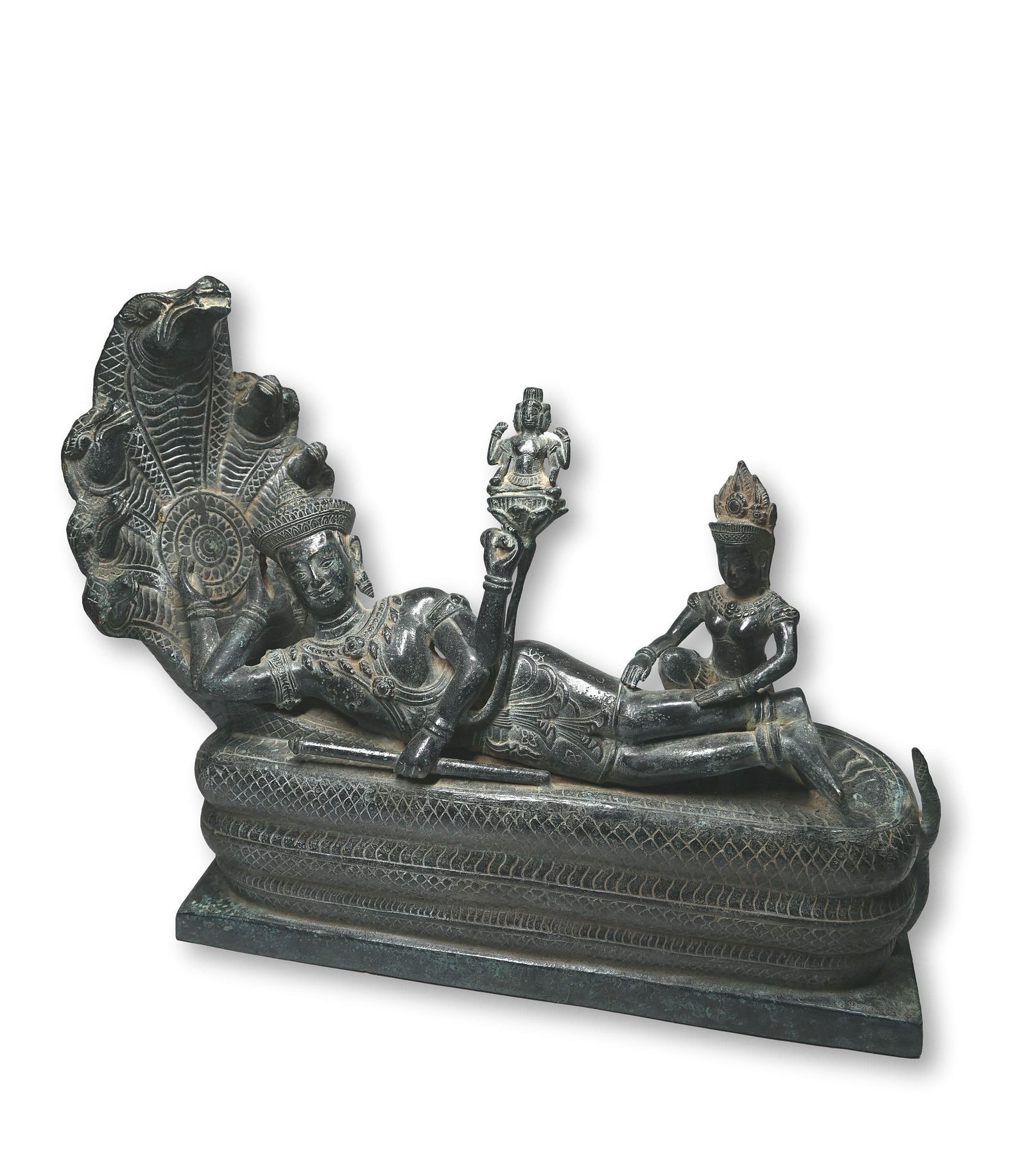 A Cambodian Bronze Image of the Reclining Vishnu: This is a finely cast bronze image of the Reclining Vishnu, also known as Anantasayana Vishnu.This depiction of Vishnu lying in a relaxed, reclining posture upon the coiled body of the serpent Ananta