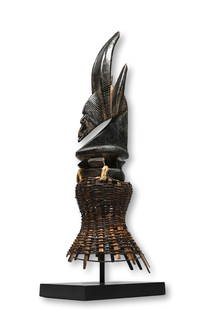 A Chiwara Headdress Ex Arcade Gallery: A Fine vertical carved wooden chiwara antelope headdress with stylized form and attached basketry cap. This mask is a combination of Chiwara and of a Sogoikun headdress, like Chiwara, this masquerade