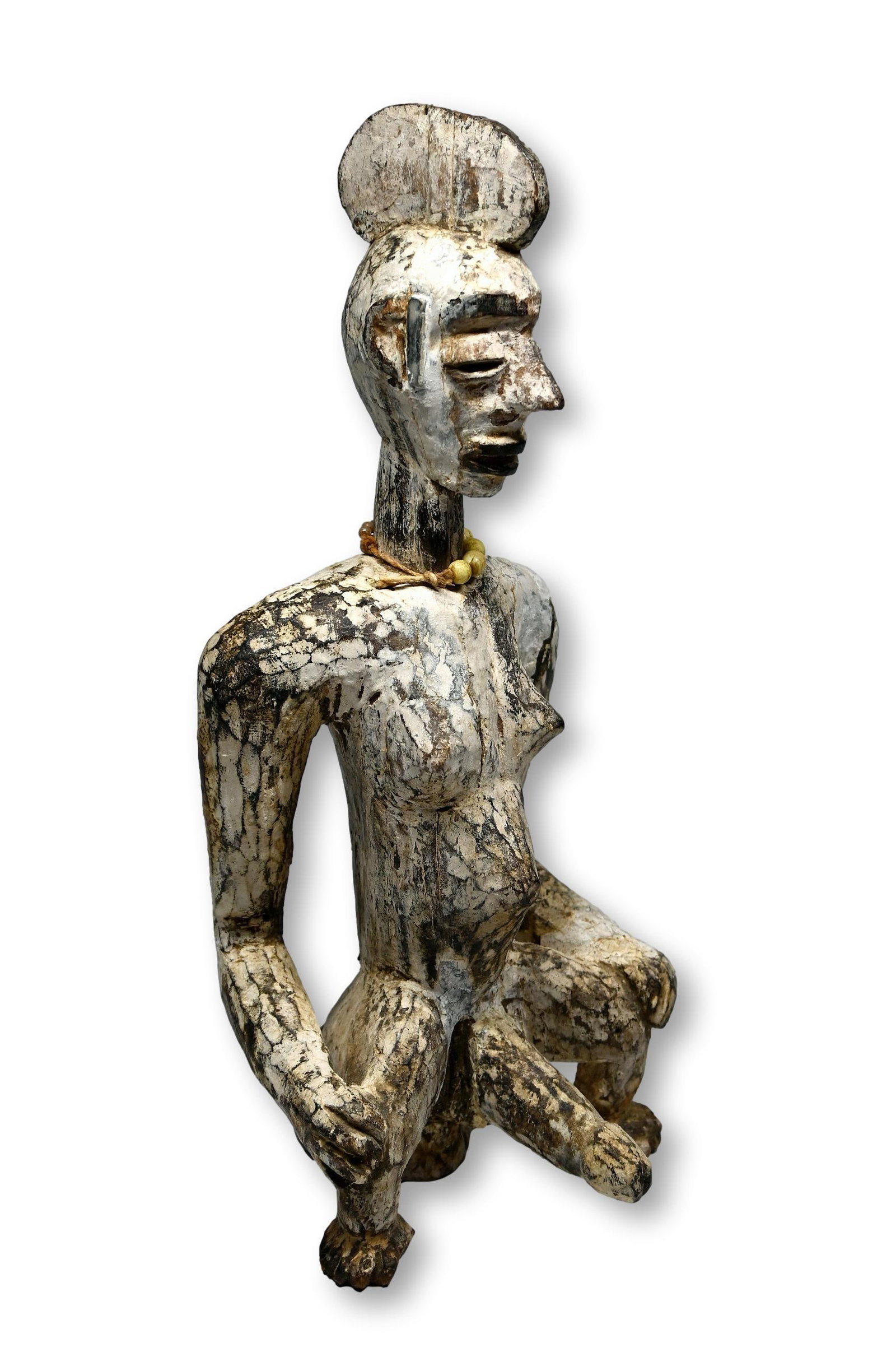 Idoma Male Effigy Ex Arcade Gallery London 1977: A rare carved wooden male effigy used in the teaching of circumcision ceremonies to young men in the community. The sculpture has been painted with white kaolin clay and features a proud male, seated 