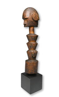 A Highly Stylized Senufo Sculpture: A find old stylized ancestral sculpture with classical facial features and post like form. The figure has been mounted to a marble base and appears to have great age. Senufo peoples, Ivory Coast / Mal