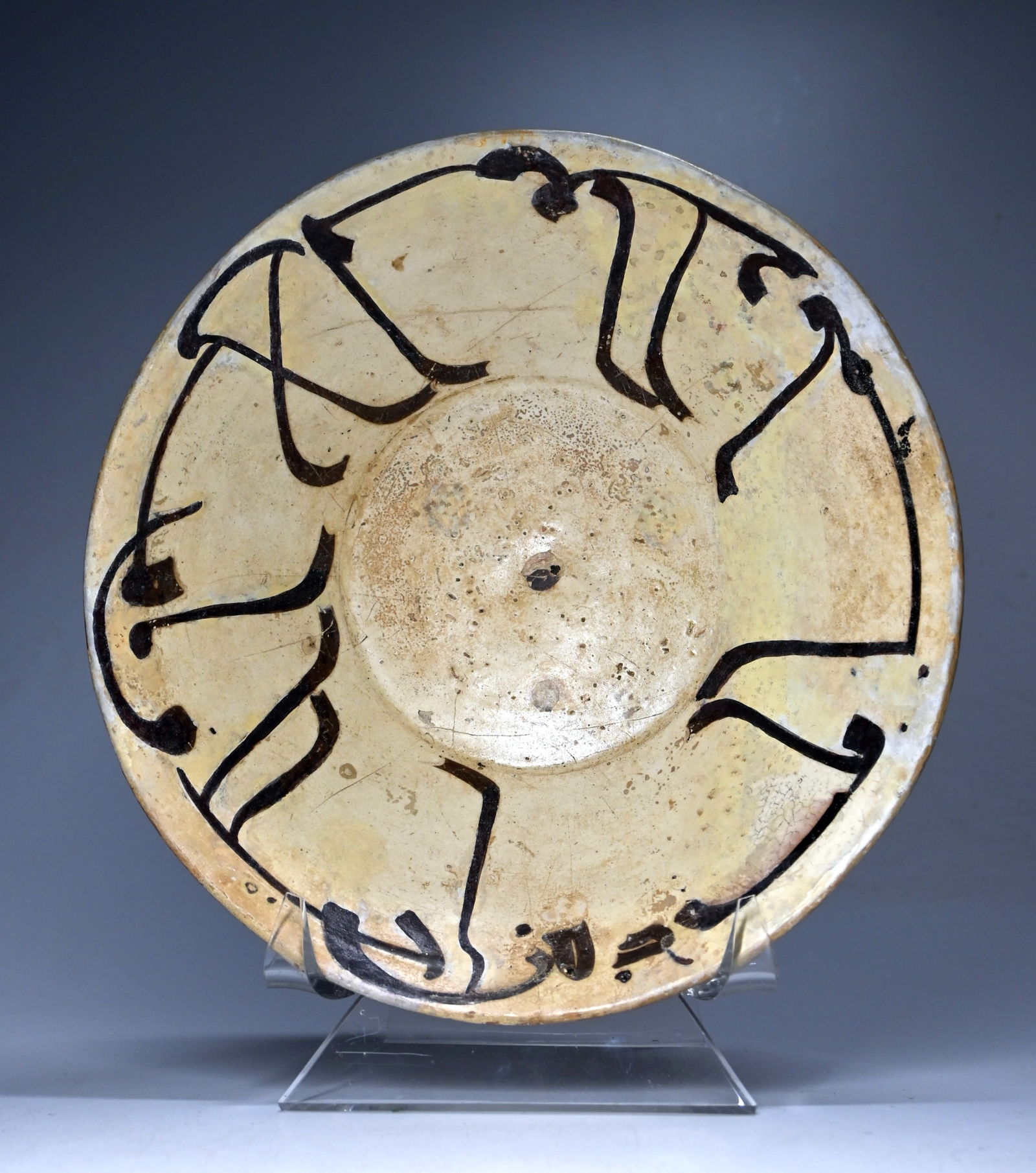 Ancient Persian Samanid Arabic Calligraphic Ceramic Bowl: This is an authentic ancient clay bowl from Iran or Uzbekistan, Samanid Dynasty, Nishapur or Samarqand, ca. 10th century AD. A truly lovely ancient terracotta bowl with a flat base glazed with a black