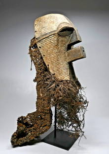 Field Collected Songye Kifwebe Society Mask: A carved wooden ceremonial dance mask carved in the classic form to represent a female. The mask was decorated with incised linear designs accented with kaolin clay and is adorned with a long woven ro