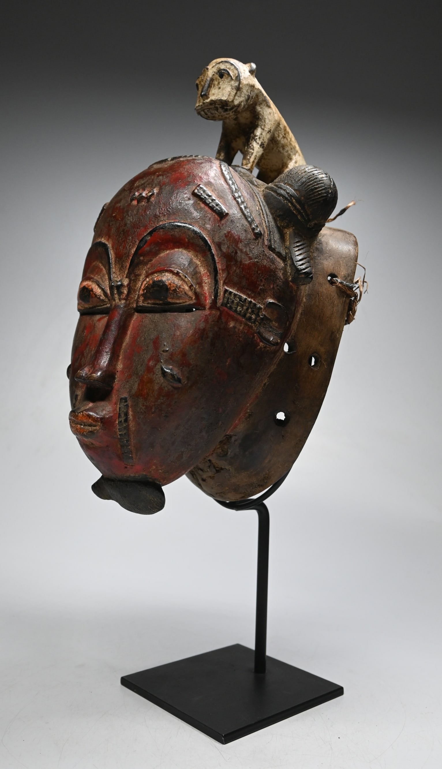 A Red Baule Mask with Leopard Motif (1 of 6)
