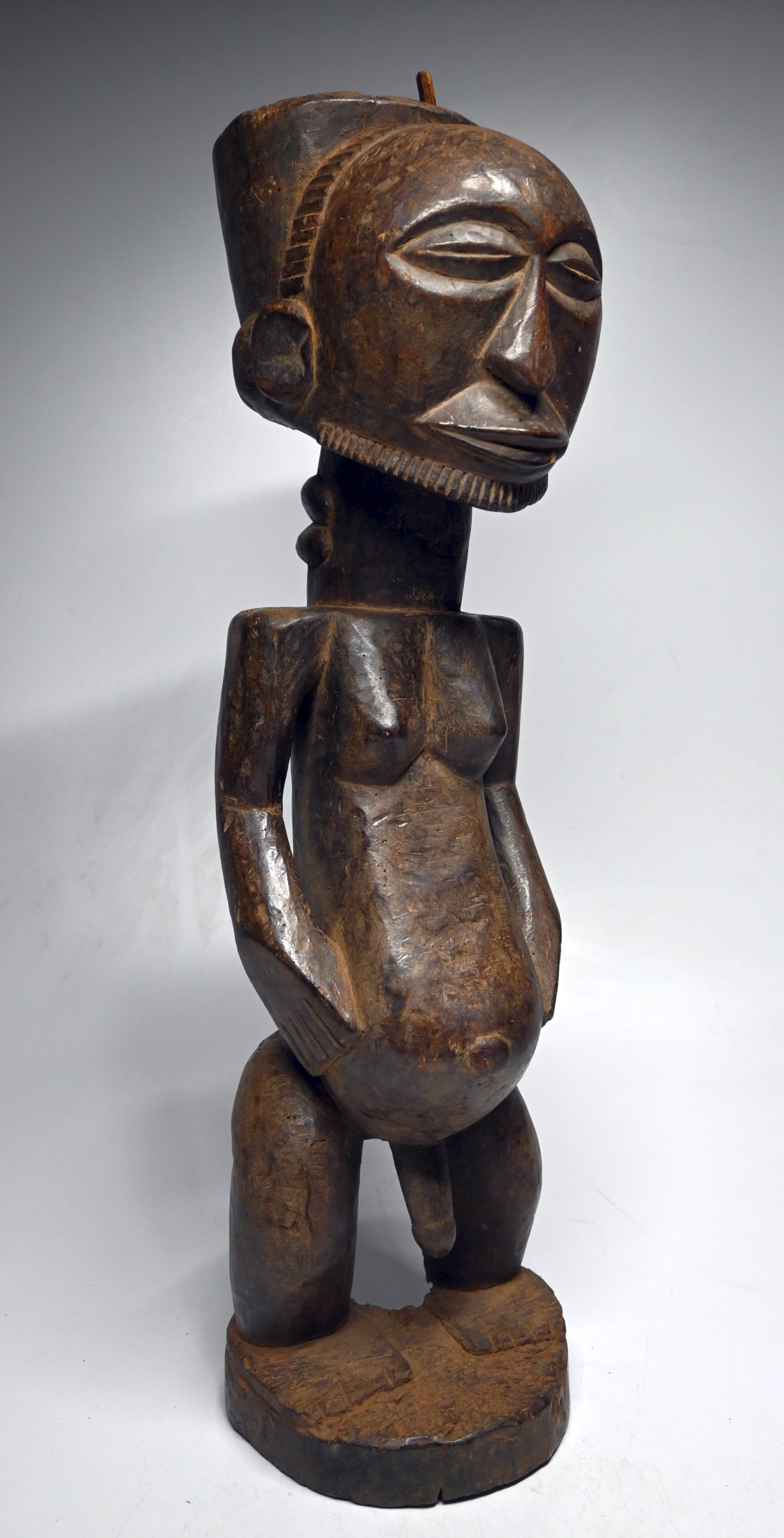 A Hemba Male Magic sculpture: This is a carved wooden commemorative sculpture of a male ancestor from the Hemba peoples, of the DRC/ Congo, central Africa. This sculpture was carved from a very heavy dense wood with signs of wear.