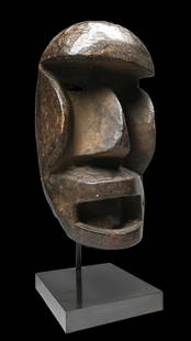 Dan Kagle Mask Ex Christies London: A Carved wooden ceremonial mask with bold features and well handled surface. The Kagle masks are konan locally as troublemakers meant to disturb village festivities with their erratic movements and ag