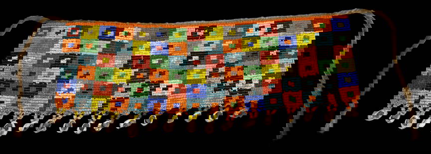 A Wonderful Geometric Beaded Skirt from the Kirdi: Antique beaded skirt with colorful geometric designs. Among some Cameroon groups, women simply wore pubic aprons also known as 'caches sexes’ (literally - ‘to hide the sex’) until approximately