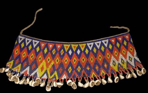 Antique Beaded Skirt Panel Ex Banks Collection: A large beaded panel with colorful geometric designs. Among some Cameroon groups, women simply wore pubic aprons also known as 'caches sexes’ (literally - ‘to hide the sex’) until approximately